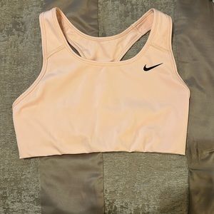 Nike sports bra. Very light Orange/ salmon color. Size Medium. Like new.